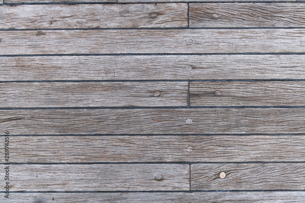 Grey wooden background - old teak deck Grey wooden background - old teak deck