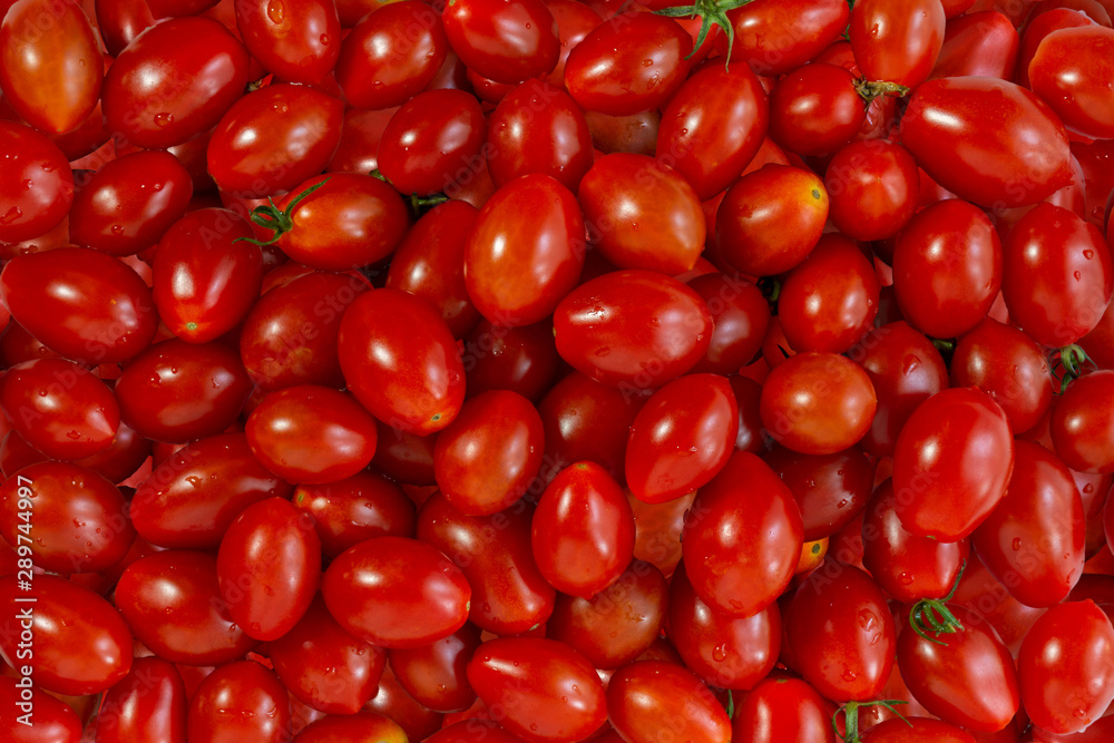 red cherry tomatoes closeup. Background, texture red cherry tomatoes closeup. Background, texture