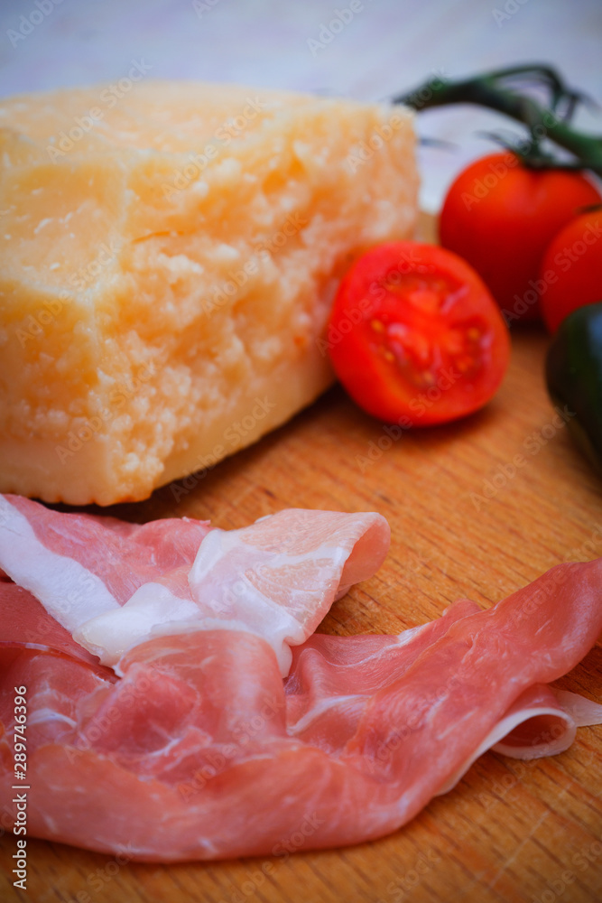 Italian food, prosciutto, olives, cheese and tomatoes Italian food, prosciutto, olives, cheese and tomatoes