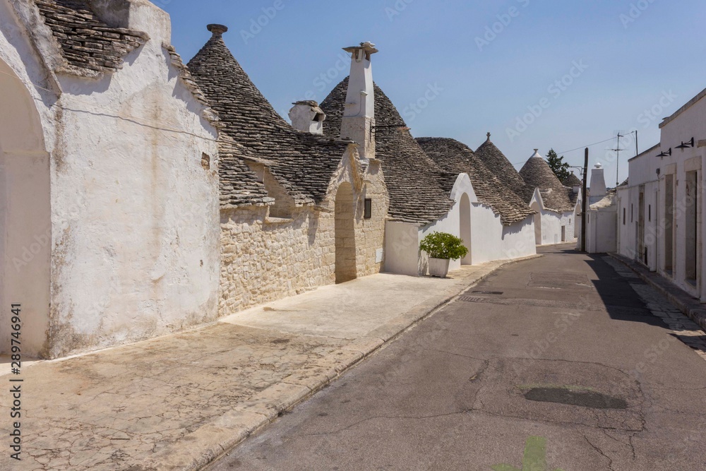 ALBEROBELLO, ITALY - AUGUST 27 2017: Day view of traditional trullo houses in southern Italy