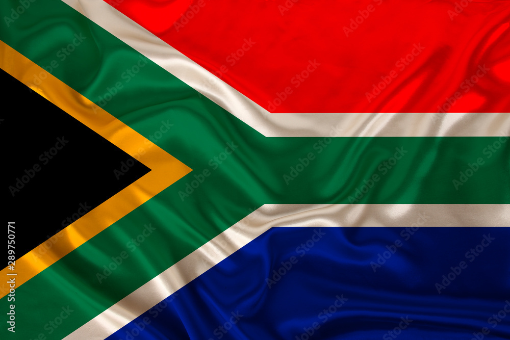 photo of the national flag of South Africa on a luxurious texture of satin, silk with waves, folds and highlights, close-up, copy space, travel concept, economy and state policy, illustration