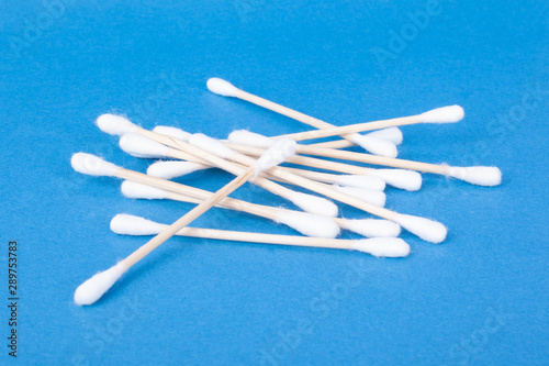 cotton buds for cleaning auricles on blue background 