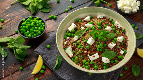 Quinoa salad with green pea, mint, feta cheese and chilli flake. healthy diet food