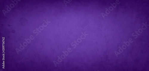 Purple background with paint stains and spatter and old vintage grunge textur...