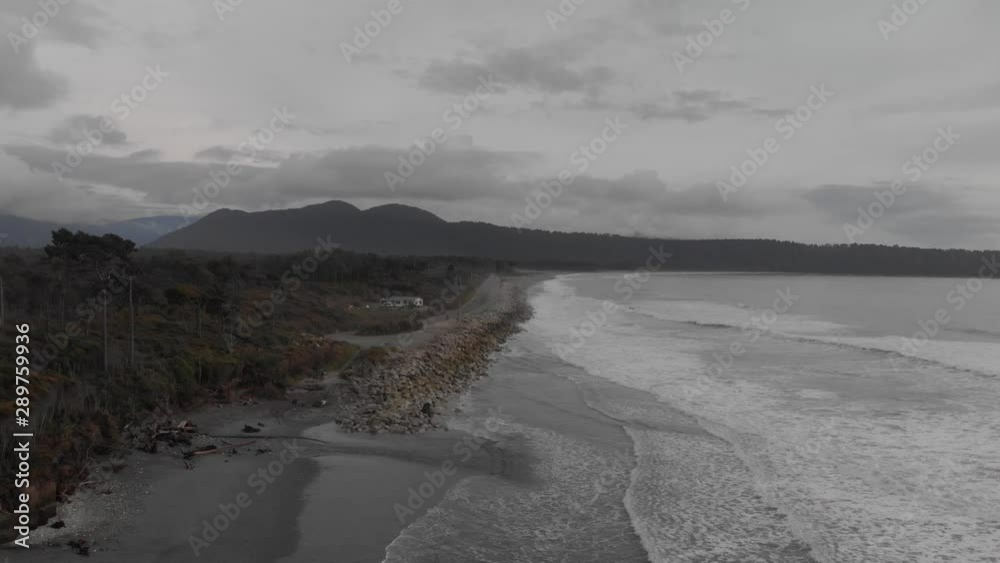 Aerial of Picturesque West Coast of New Zealand. Tasman Sea Waves and Wonderful Landscape on Cloudy Autumn Day Aerial of Picturesque West Coast of New Zealand. Tasman Sea Waves and Wonderful Landscape on Cloudy Autumn Day