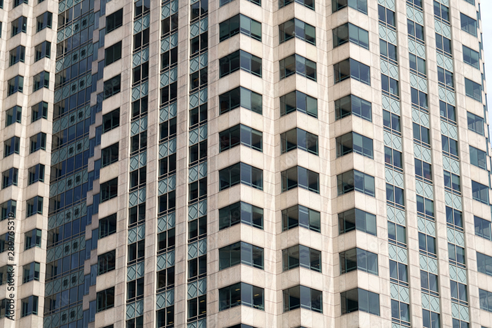 close up on facade view of glass windows in office building