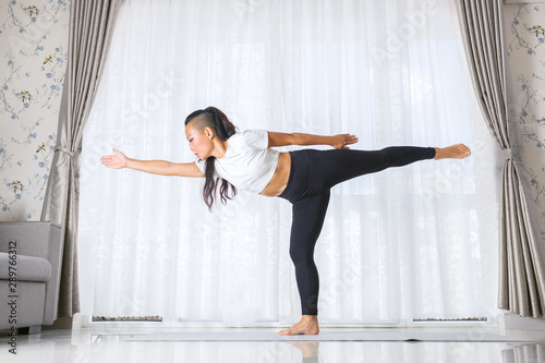 Young asian woman exercising and doing yoga