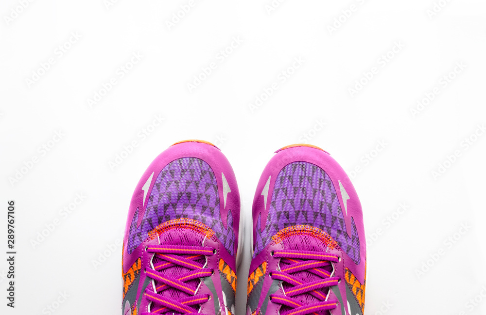 Sport sneakers on the white background with copy space for text, top view. Sport concept. Accessories for fitness and running.