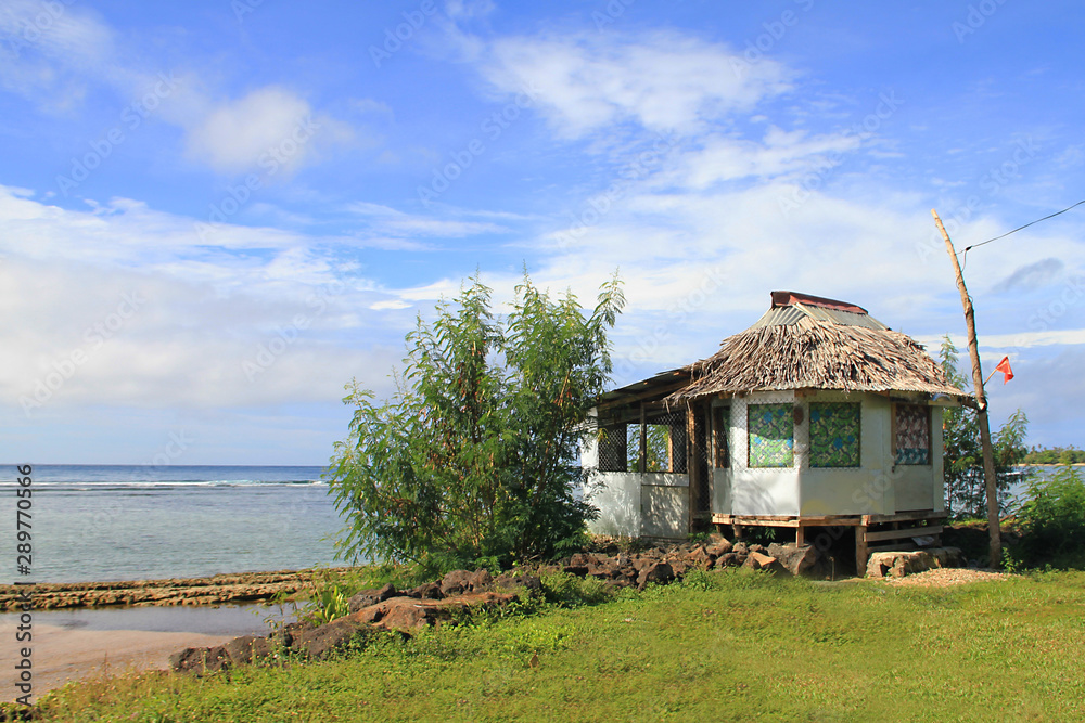 Fototapeta premium A beach fale is a simple thatched hut in Samoa. Beach fales are also common in other parts of Polynesia. Built with a few posts, no walls and a thatched roof with a round or oval shape.