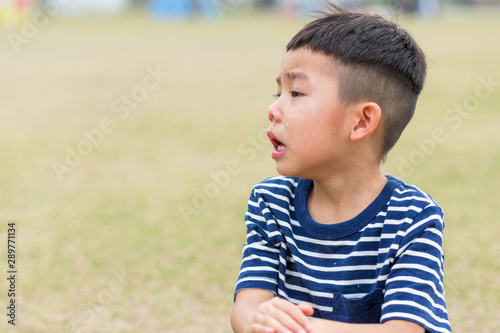 Asian little cry in the park