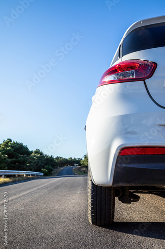 Closeup white car on the road