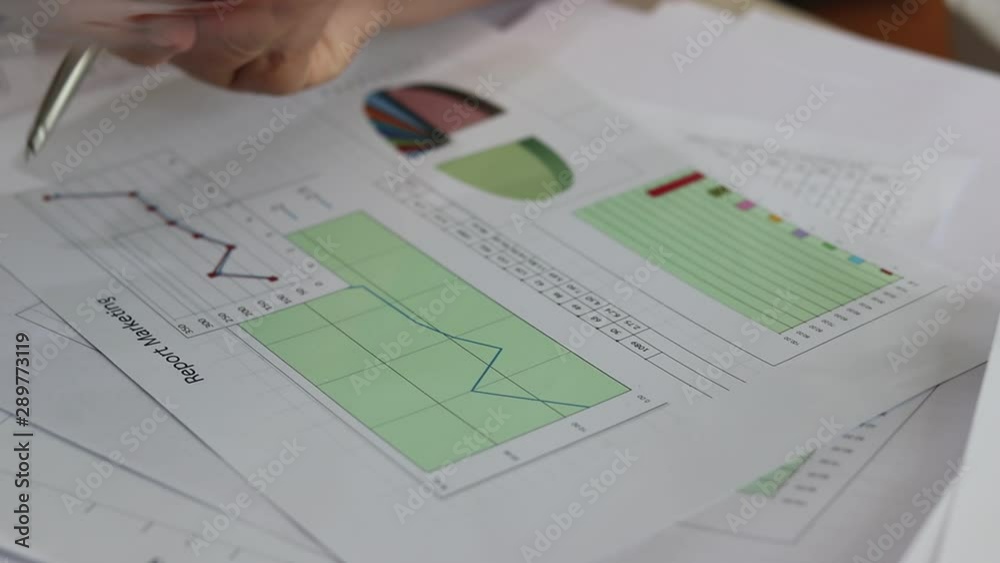 Data analysis and project management concept. Asia businesswoman analyzing statistics and working with business report graphs charts using pencil in order to improve their performance. Data analysis and project management concept. Asia businesswoman analyzing statistics and working with business report graphs charts using pencil in order to improve their performance.