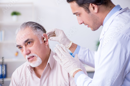 Male patient with hearing problem visiting doctor otorhinolaryng