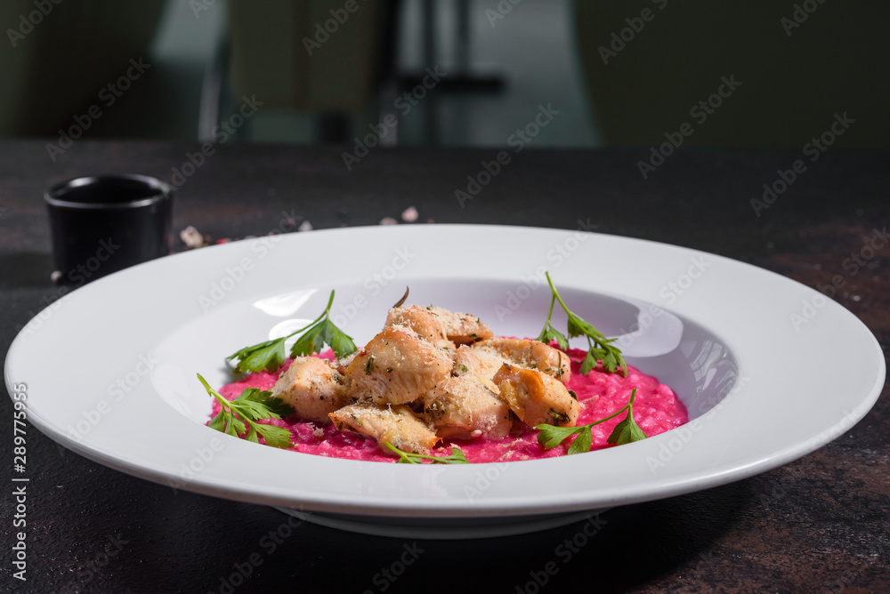 Delicious risotto with roasted pieces of chicken fillet. Risotto with chicken pieces. Delicious risotto with roasted pieces of chicken fillet. Risotto with chicken pieces.