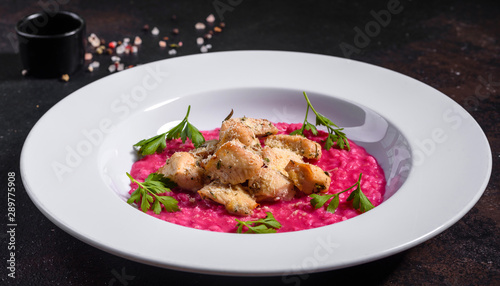 Delicious risotto with roasted pieces of chicken fillet. Risotto with chicken pieces. 