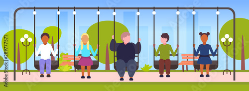 fat obese guy swinging with mix race friends obesity concept people sitting on swing having fun outdoor landscape background flat full length horizontal