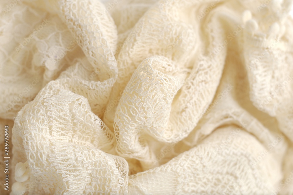 Ivory color crochet sweater. Texture detail close up.