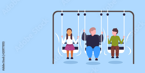 fat obese guy swinging with friends obesity concept overweight man sitting on swing having fun flat full length horizontal