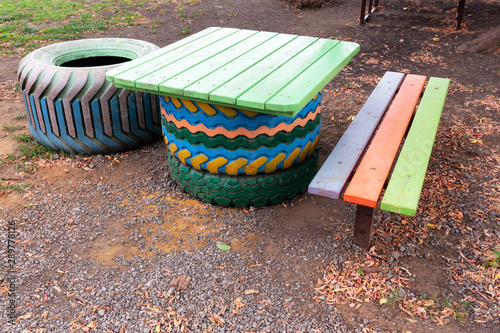 Homemade furniture set of old, used tires and wood on the Playground.