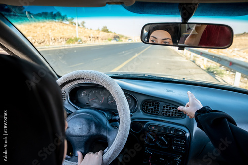 Two arabic women driving while arguing © Diya