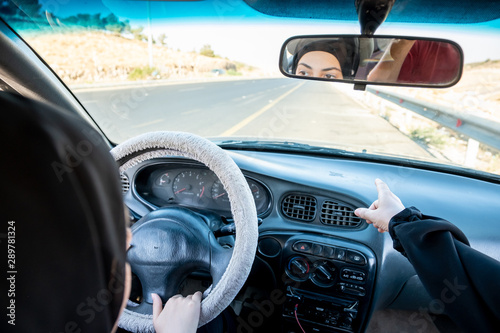 Two arabic women driving while arguing © Diya
