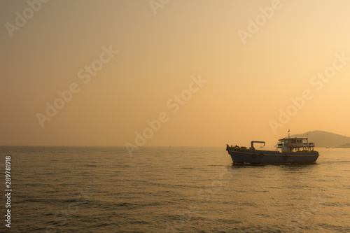 boat at sunset © tusumaru