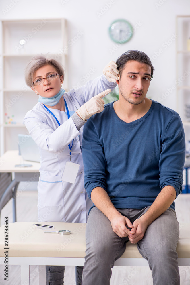 Young patient visiting doctor in hospital Young patient visiting doctor in hospital