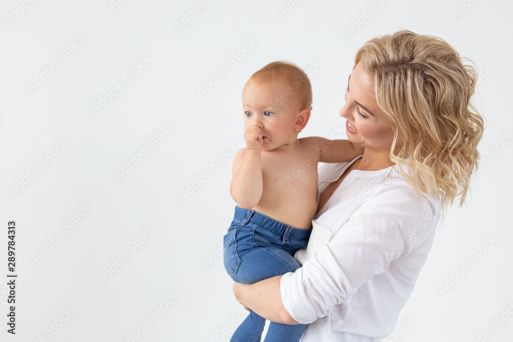 Happy mother with adorable baby on white background with copy space Happy mother with adorable baby on white background with copy space