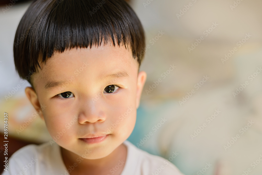 The boy was thinking and staring. The right side of the image is a copy space. The boy was thinking and staring. The right side of the image is a copy space.