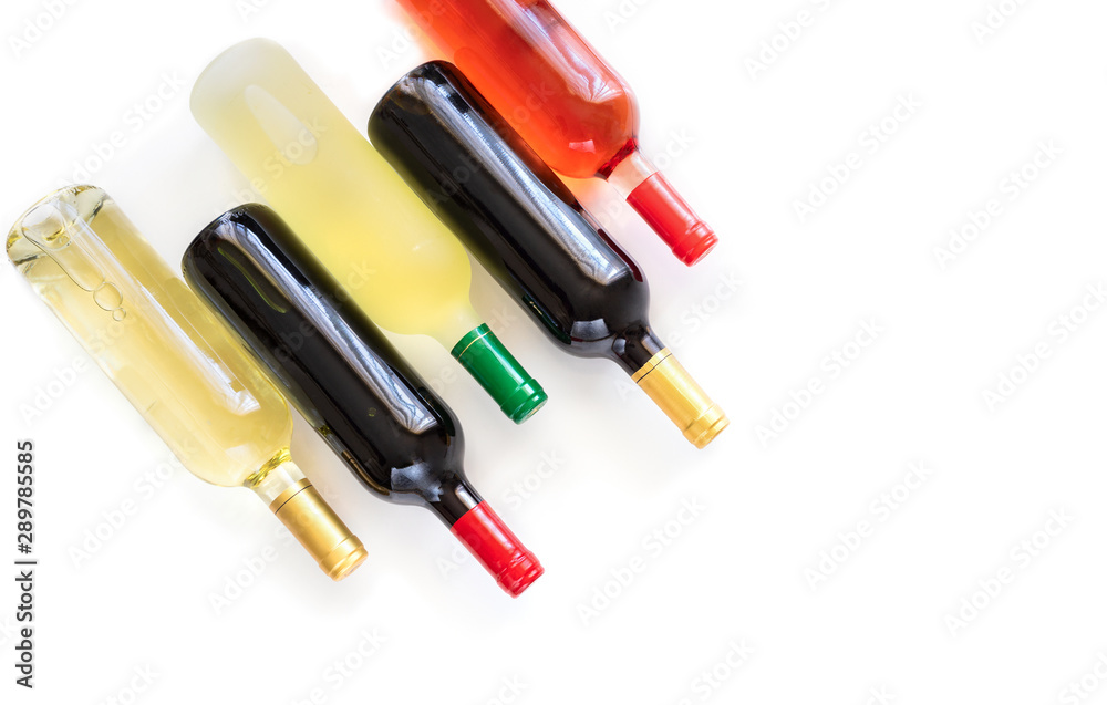 Bottles of different wines red, white, rose and Bordeaux on white background with copy space Bottles of different wines red, white, rose and Bordeaux on white background with copy space