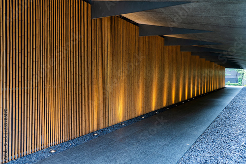 Bottom Lighting of Bamboo Wall Along the Corridor.