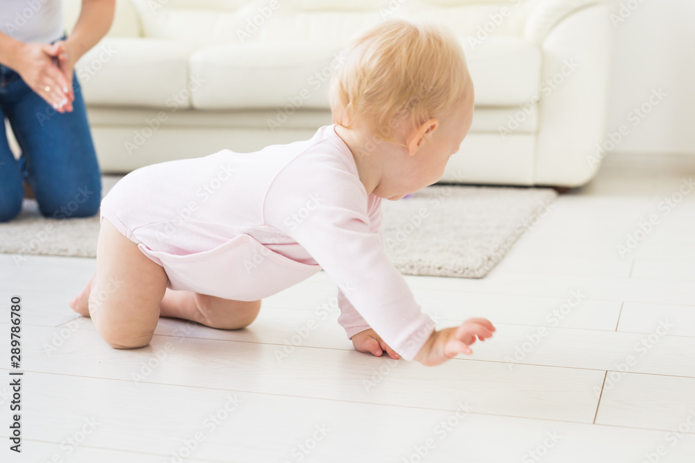 Smiling crawling baby girl at home on floor Smiling crawling baby girl at home on floor