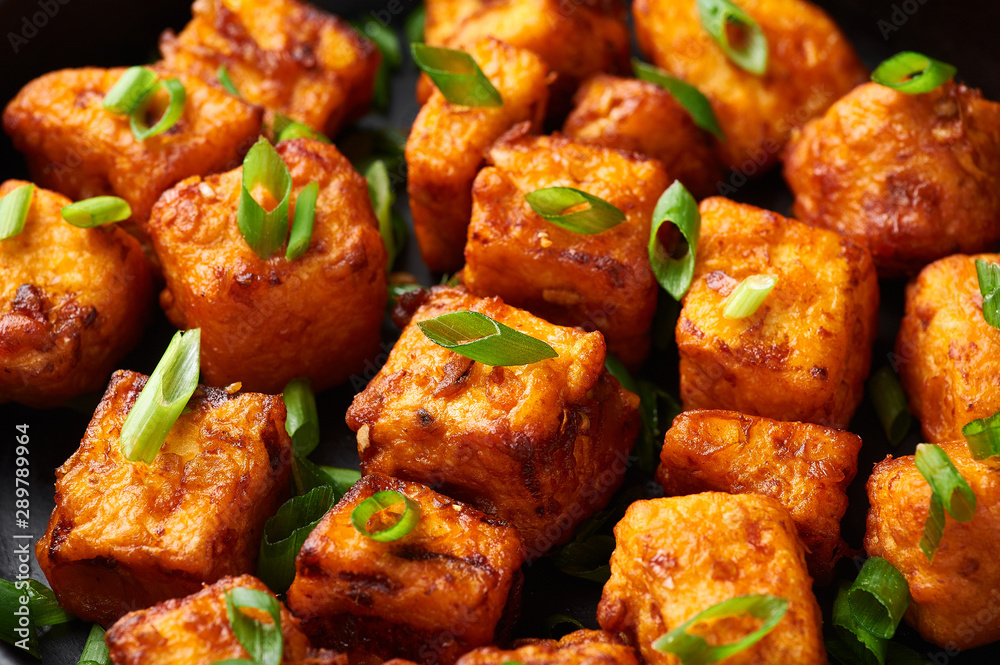 Paneer Manchurian or Paneer 65. Paneer Manchurian is Indian Chinese cuisine dish with panner cheese, tomatoes, onion, soy sauce. Close Up Paneer Manchurian or Paneer 65. Paneer Manchurian is Indian Chinese cuisine dish with panner cheese, tomatoes, onion, soy sauce. Close Up