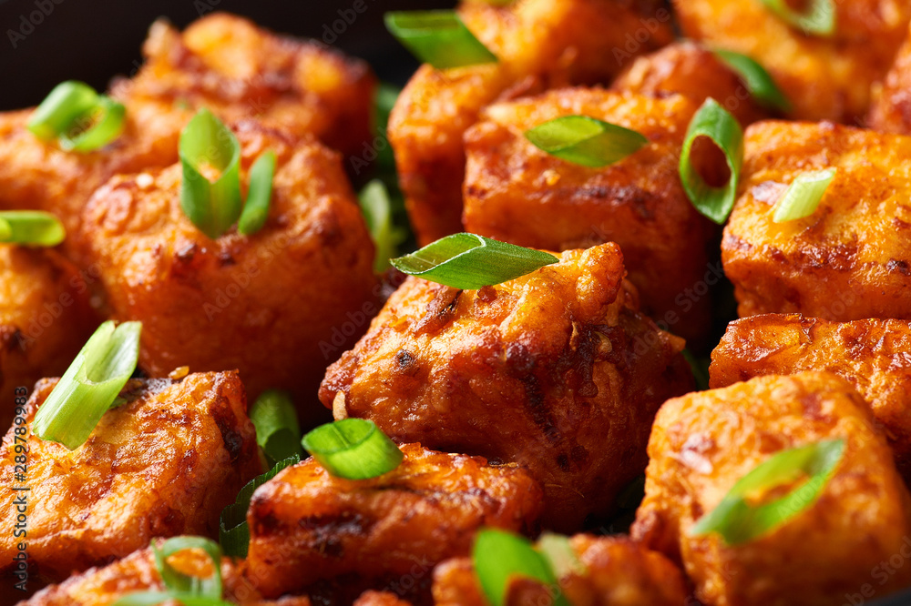 Paneer Manchurian or Paneer 65. Paneer Manchurian is Indian Chinese cuisine dish with panner cheese, tomatoes, onion, soy sauce. Close Up