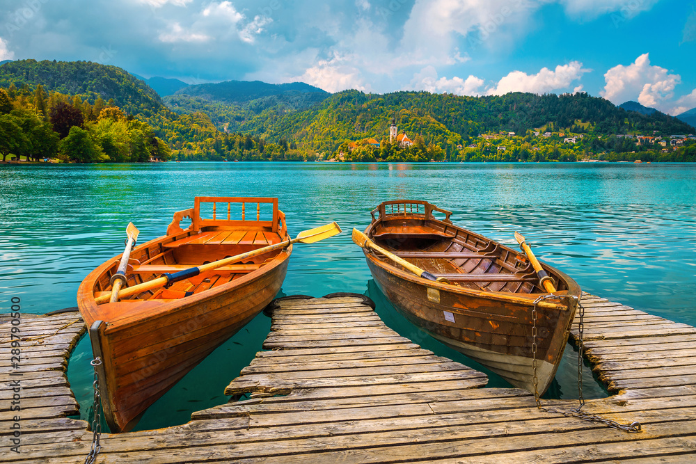 Traditional wooden boats moored on the lake Bled, Slovenia
