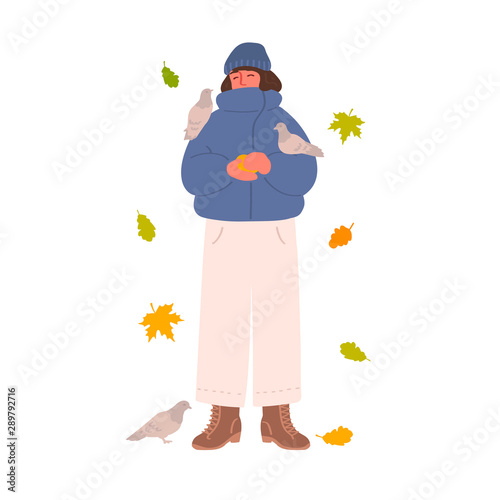 Young brunette girl in a jacket and hat feeds pigeons. Autumn leaves. Character isolated on a white background. Vector illustration in hand drawn style