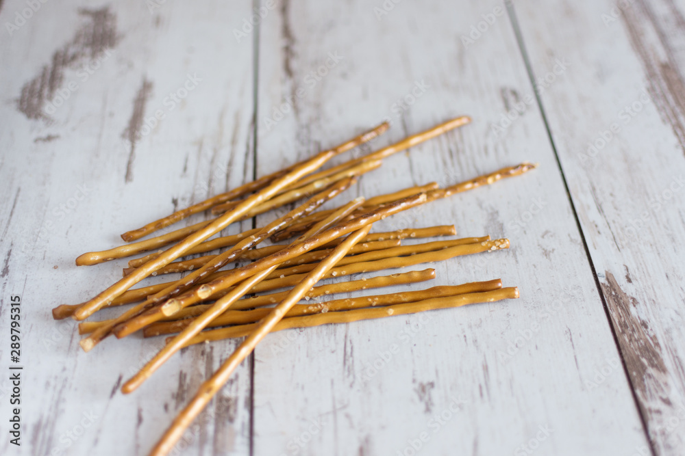 Salted bread sticks, salted straw snack. Salted bread sticks, salted straw snack.