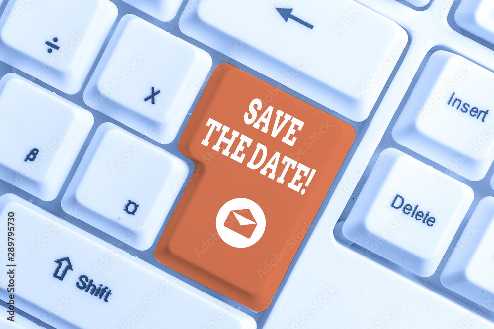 Conceptual hand writing showing Save The Date. Concept meaning remember not schedule anything else on this day White pc keyboard with note paper above the white background Conceptual hand writing showing Save The Date. Concept meaning remember not schedule anything else on this day White pc keyboard with note paper above the white background
