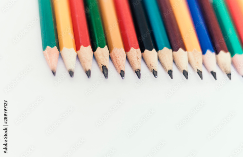 colored pencils on white table, back to school education concept background. colored pencils on white table, back to school education concept background.