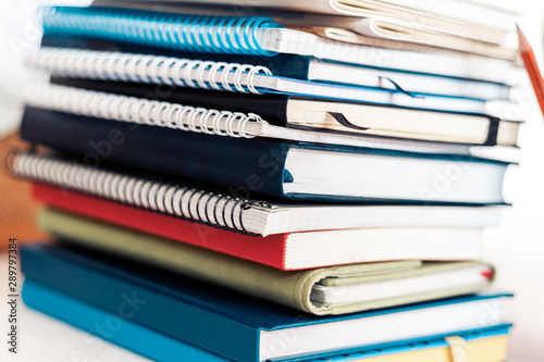 Notebooks piles, stack of books education back to school background, textbooks with copy space for text.