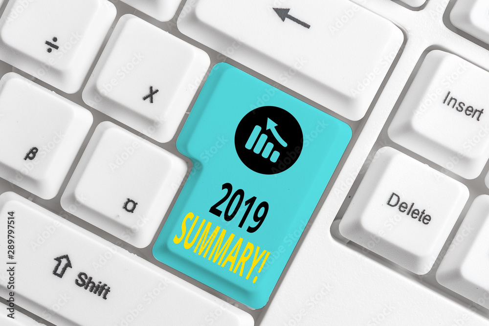 Word writing text 2019 Summary. Business photo showcasing summarizing past year events main actions or good shows White pc keyboard with empty note paper above white background key copy space Word writing text 2019 Summary. Business photo showcasing summarizing past year events main actions or good shows White pc keyboard with empty note paper above white background key copy space