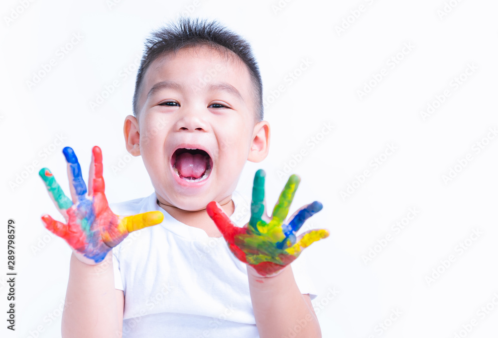 Happy asian little baby boy show hand he have water color or finger paint on hands Happy asian little baby boy show hand he have water color or finger paint on hands