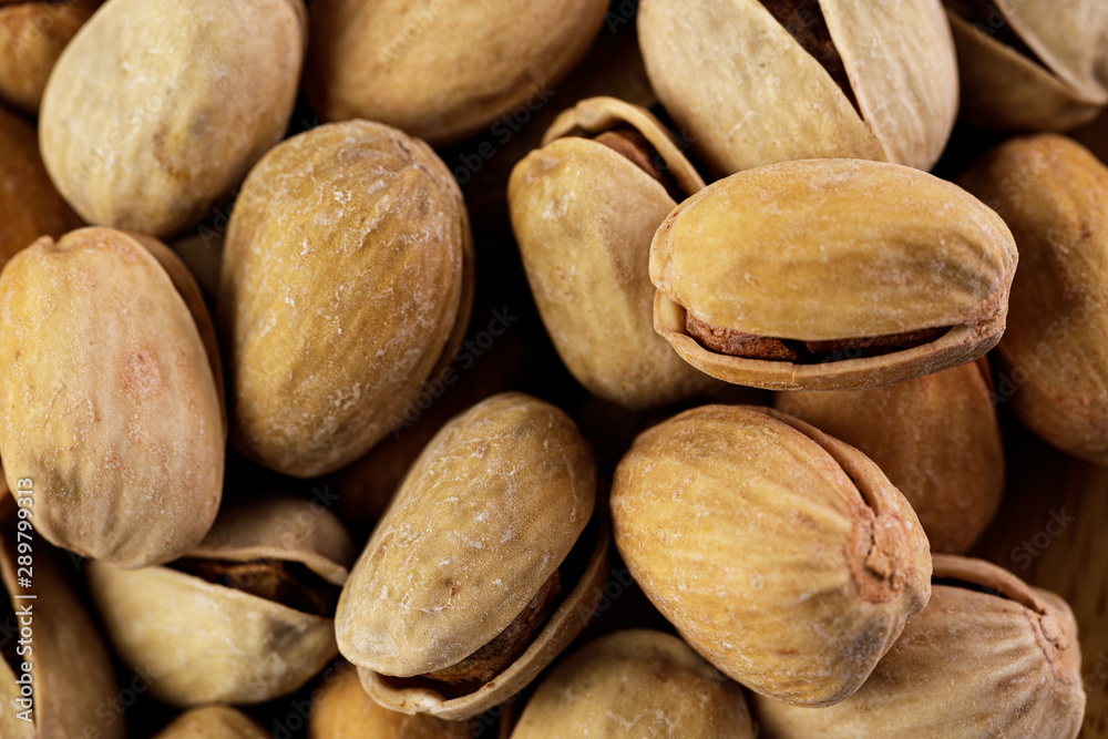 Obraz premium Pistachio texture. Nuts. the salted pistachios background.