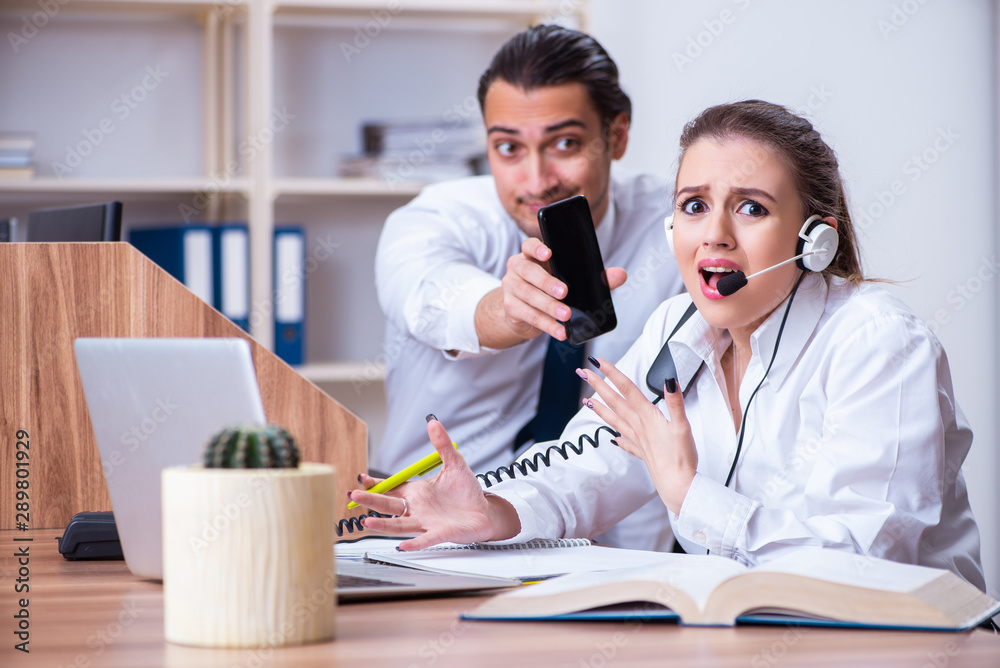 Call center operators working in the office Call center operators working in the office