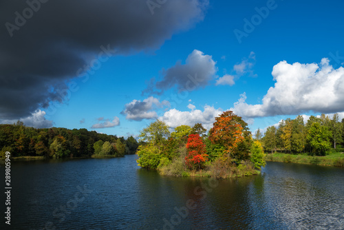 A dark cloud on a clear autumn day.