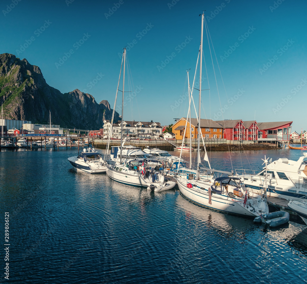 View of the city of Svolvaer, Norway, Lofoten Islands, beautiful summer landscape, houses and yachts on a background of mountains