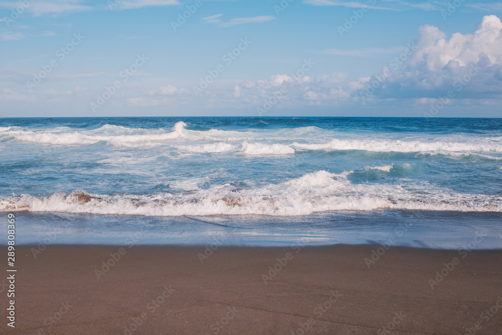 beautiful blue ocean and black sand beach on the Azores, in Portugal