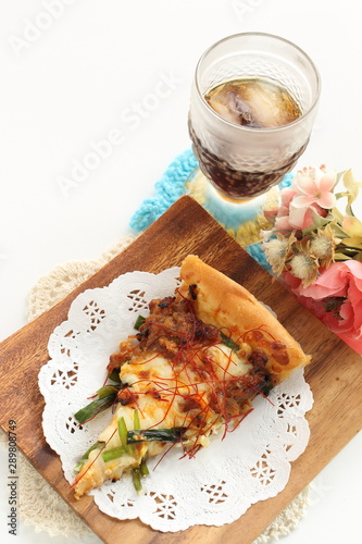 Fusion pizza, beef and leek with chili pepper Asian taste