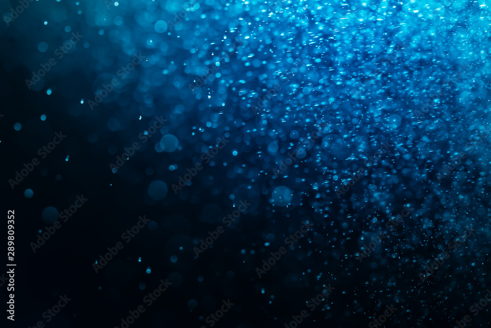Abstract Blue bokeh defocus glitter blur background.
