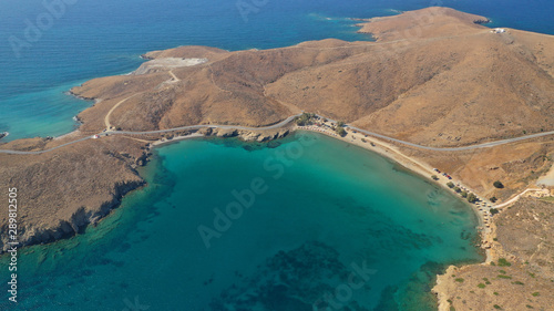 Aerial drone photo of famous calm turquoise sea sandy beaches of Steno next to small chapel of Agios Mamas, Astypalaia island, Dodecanese, Greece